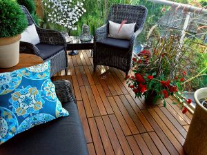 Beautiful balcony Ipe wood deck tiles with beautiful flowers and furniture